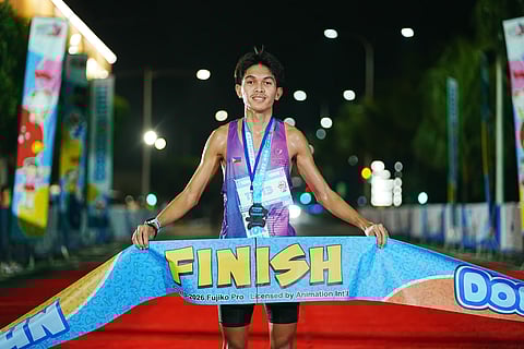 VINCENT Arvin Avestruz smiles as he crosses the finish line to win the men’s 10K event of the Doraemon Run 2026 at SM Mall of Asia Complex on Sunday.    