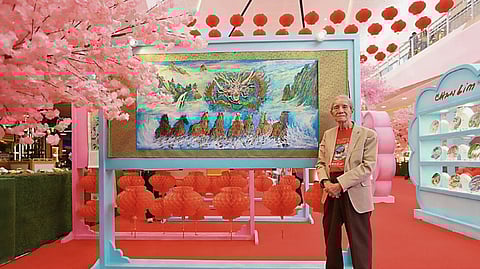 HONORING the roots of a lasting legacy — Jose Chan Lim, patriarch of the Chan Lim family of artists, showcases one of his paintings at the art exhibit.