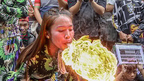 Street dancers perform fire-breathing stunts that echo a dragon’s breath during a street exhibition in Binondo, Manila, in celebration of the Lunar New Year on Tuesday, 17 February 2026. The performance is accompanied by loud drumbeats from a drum ensemble. | Aram Lascano/DAILY TRIBUNE 