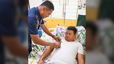 PRO3 Director Rogelio Peñones awards PSSg Jake Jacinto the Medalya ng Sugatang Magiting as the officer recovers from wounds sustained in an encounter following a dragnet operation on 17 Feb.