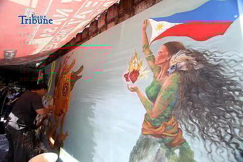 (February 18 2026) Artists render color palettes on a mural depicting scenes during the EDSA People Power in 1986 near the EDSA Shrine in Quezon City on Tuesday a week before the 40th EDSA People Power anniversary on Feb. 25. Photo/Analy Labor