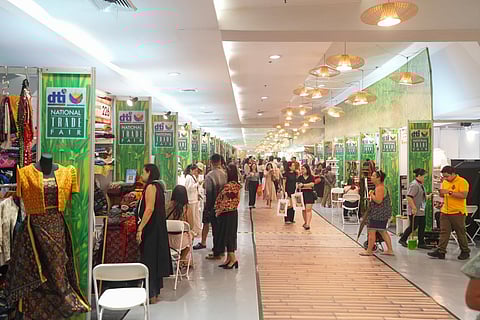 Exhibitors are positioned to sell their products at the Megatrade Halls 1–3 of SM Megamall in Mandaluyong City on Wednesday.