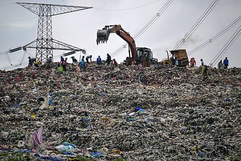 A HEAVY machinery is leveling a massive pile of waste at the Cipayung landfill in Depok, West Java, which often slides and clogs the river, sending waste to the outskirts of Jakarta during heavy rains.