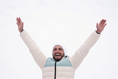 Silver medallist Individual Neutral Athletes' Nikita Filippov celebrates on the podium after competing in the men's sprint ski mountaineering event during the Milano Cortina 2026 Winter Olympic Games at the Stelvio Ski Centre in Bormio (Valtellina) on February 19, 2026.
