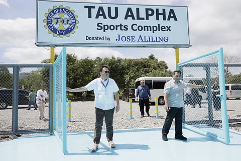 DHSUD Secretary Jose Ramon Aliling (left) and UPLB Chancellor Jose Camacho Jr. (right) lead the opening of the newly inaugurated Tau Alpha Sports Complex at the UPLB.