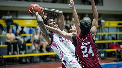 PRECIOUS Momowei of CEU overcomes the suffocating defense of PWU en route to posting a 72-57 victory in the UCAL Season 8 basketball tournament last Thursday at the Paco Arena.