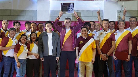 RENE ‘Bong’ Hawkins celebrates with Perpetual president Dr. Anthony Tamayo, vice president for Sports Anton Tamayo, and some of his former teammates and administration officials during his jersey retirement on Friday.