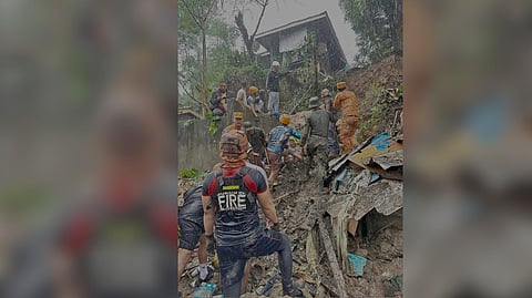 RESCUERS race against time to recover and rescue the people trapped in a landslide in Upper Salazar, Mati City in Davao Oriental on Friday.