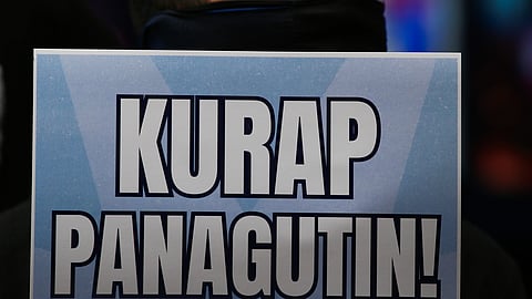 A MEMBER of the Working People Against Corruption, a coalition of workers’ groups and unions, joins a Black Friday protest along Recto Avenue, calling for higher wages and accountability for alleged government corruption.