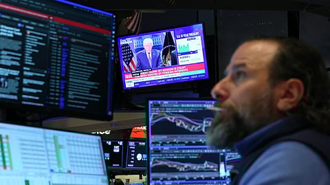 WALL Street trader keeps tab of a televised press conference by US President Donald Trump on tariffs at the New York Stock Exchange. Trump raised the new set of tariffs to 15 percent yesterday, the largest allowed under Section 122, doubling down on his promise to maintain his aggressive tariff policy a day after the Supreme Court ruled much of it illegal.