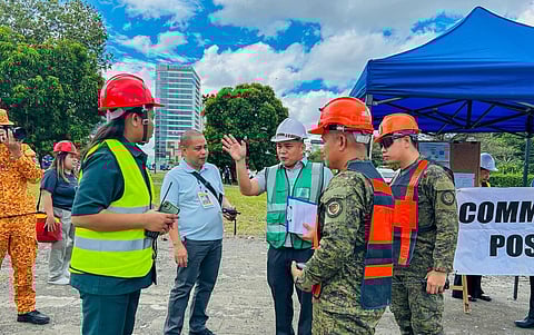 Simulating Safety — Ahead of the ASEAN summit, the STGEPR-RIMT conducts a full-scale emergency drill in Iloilo City under the watchful supervision of Raul Fernandez to assess the city’s crisis response capabilities.