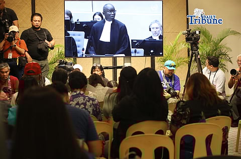Families of the EJK victims watch the International Criminal Court (ICC) confirmation of charges hearing against former President Rodrigo Duterte in his crimes against humanity case linked to the government’s anti-drug campaign, held at Atencio Libunao Hall in the University of the Philippines, Diliman, Quezon City, on Monday, 23 February 2026.