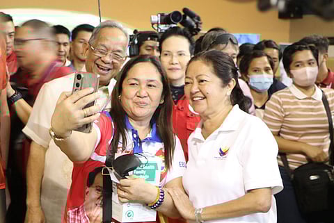 First Lady Louise “Liza” Araneta-Marcos and SBMA Chairman and Administrator Eduardo Jose L.  Aliño are all smiles as an official from Zambales takes a groupie with the two during the Lab for All event at the Subic Bay Exhibition and Convention Center (SBECC) in this Freeport on February 24, 2026.