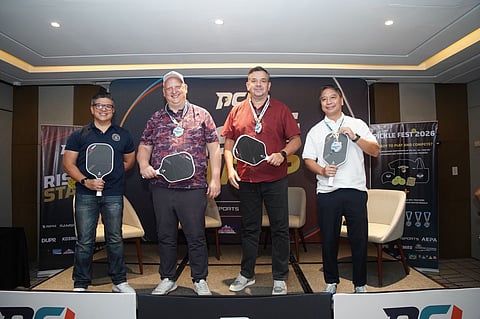 STEVE Kuhn (second from left), founder of the Pickleball Champions League, and Kosmas head of operations Richard ‘Dickie’ Bachmann (second from right), pose with a pickleball paddle and ball during the official launch of the PCL Asia Rising Stars U19 Sectional Tournament at Acacia Hotel in Davao City Tuesday. Also shown are Mikey Aportadera (left), head of Davao City Sports, and tournament organizer Jay Angala.