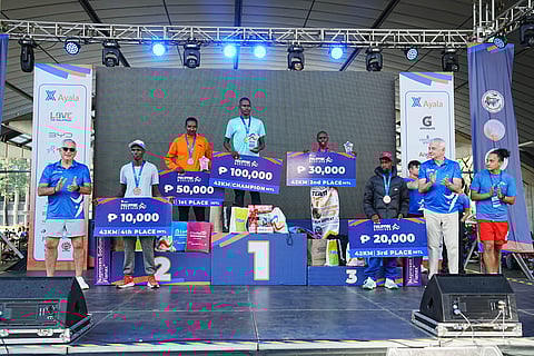 ANDERSON Saitoti of Kenya (center) emerges as the biggest winner in the Ayala Philippine Marathon 2026 over the weekend.