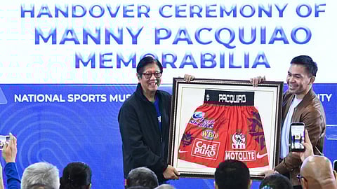 MANNY Pacquiao hands over a piece of historic memorabilia to President Ferdinand ‘Bongbong’ Marcos Jr., symbolizing his courage, determination and resilience both as a boxer and as a Filipino.