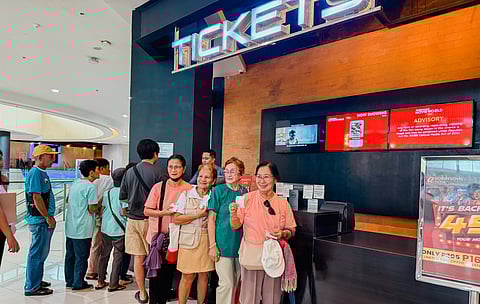 Smiles on the Silver Screen — Beaming lolas line up to avail of the free movie screening under the “Libre Sine” program of the Municipality of Pavia, rolled out through its Municipal Council, turning an ordinary day into a joyful cinematic treat for senior citizens.