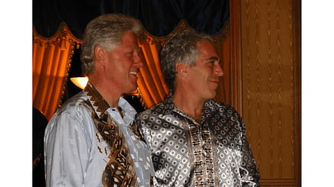 HANDOUT/US DEPARTMENT OF JUSTICE/
AGENCE FRANCE-PRESSe
JEFFREY Epstein (right), a wealthy US financier who died in jail in 2019 while awaiting trial for sex trafficking underage girls, and former President Bill Clinton in an unidentified location. 

