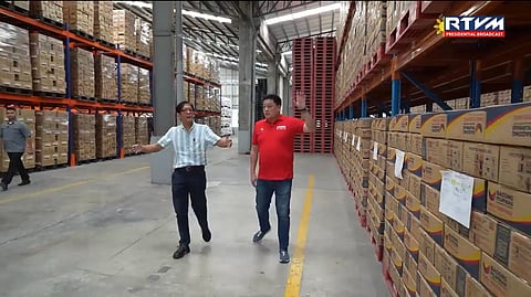 President Ferdinand Marcos Jr. is being briefed by Social Welfare and Development Secretary Sherwin Gatchalian during their inspection of the Mechanized Production System (MPS) by the Visayas Disaster Resource Center, a state-of-the-art upgrade of automatic vacuum packaging lines to its disaster response infrastructure, in the province of Cebu on Thursday.