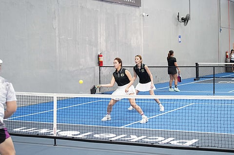 PATRICIA Calma and Rochelleen Quibingco move in perfect sync as they set up a return during their match in the 35+ High Intermediate women’s doubles of the Pickle Fest 2026 Adult Categories Sectional Tournament in Davao City.
