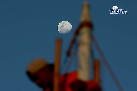 A half moon rises over the shoreline of Arevalo in Iloilo City on Saturday. A total lunar eclipse will occur on 3 March 2026 and will be fully visible in Manila, lasting about 82 minutes from 11:27 p.m. The eclipse, sometimes called a “blood moon,” occurs when the moon turns red. 