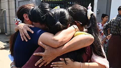 RELATIVES celebrate with a family member after she was released from Insein prison in Yangon on 2 March 2026 to mark Peasants’ Day.