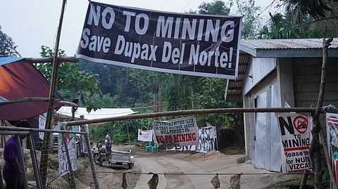 DEFENDING their land against unauthorized mining, residents of Barangay Bitnong have established a new gate at their community barricade to enforce a standing suspension order against Woggle Corporation.