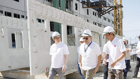 DHSUD chief Jose Ramon Aliling (center), together with SHFC President Federico Laxa 