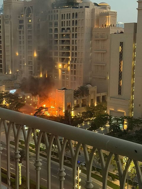 Fire blazes at luxury Dubai hotel during an Iranian air attack.
