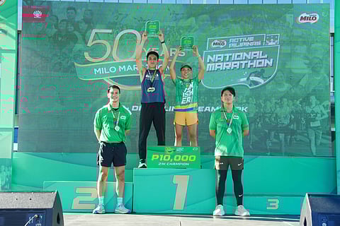 ROY Laudit and Maricar Camacho celebrate after clinching the 21K title of the National MILO Marathon Pasay leg at the SM Mall of Asia over the weekend.