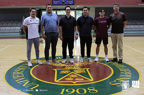 ERIC Altamirano (third from left) and his assistant coaches get a warm welcome from UP Office for Athletics and Sports Development director Bo Perasol (second from left) in his return to university.    