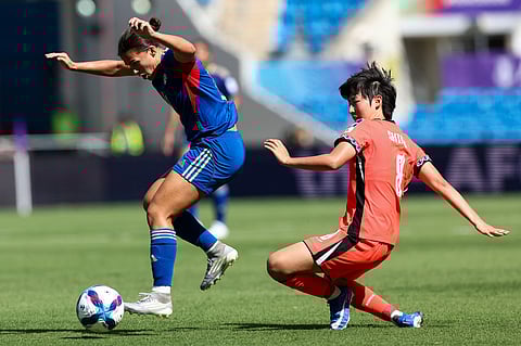 ANGIE Beard (left) of the Philippines controls ball possession over Kim Shin-ji of South Korea during their AFC Women’s Asia Cup encounter on Thursday. The Koreans won, 3-0.