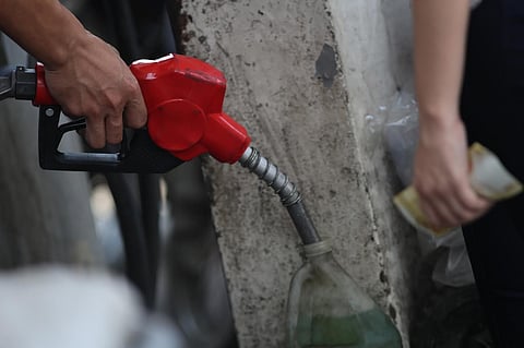 Motorcyclists queue for fuel in Tondo, Manila, on 01 March 2026