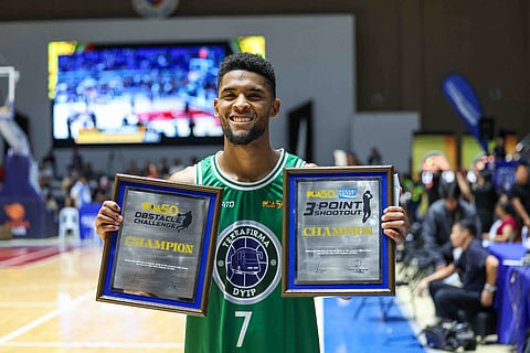 Jerrick Ahanmisi proudly shows off the hardware he collected during the PBA Season 50 All-Star festivities in Candon, Ilocos Sur.