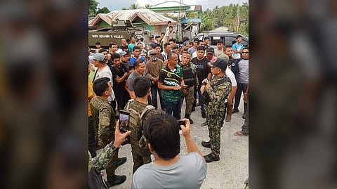 COLONEL Sultan Salman Sapal (right, black police cap), Maguindanao del Sur provincial director, meets with Barangay Linantangan officials on 5 March following a surge of violence that broke out on 4 March. Security forces remain on high alert to maintain peace and stability in the community.