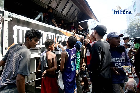 GOOD Samaritans distributed free porridge, or lugaw, to fire victims after a blaze that reached Task Force Bravo level gutted numerous houses in Barangay Pinyahan, Quezon City, on Saturday, 07 March 2026.
