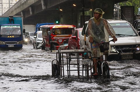 MOTORISTS push their way through gutter-deep floodwaters along Taft Avenue in Manila, a familiar sight every time there’s heavy rain.