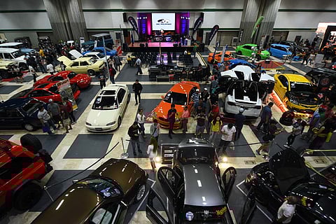 VISITORS walk through rows of display vehicles during a previous Manila International Auto Show event when the Philippine Trade Training Center served as a secondary exhibition venue.