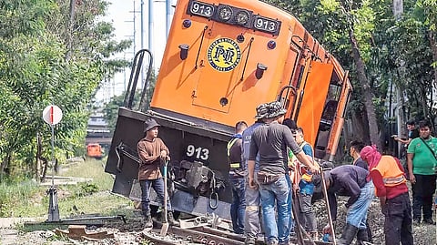 PHILIPPINE National Railways workers clear a derailed train near Don Bosco in Makati in 2023 — a moment frozen on steel and gravel months before the old line fell silent in 2024 for the North-South Commuter Railway expansion, a project that has itself lost momentum.