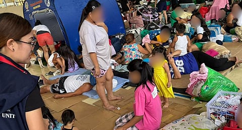 OFFICIALS from the Quezon City Epidemiology and Surveillance Division conducting health checkups on Barangay Pinyahan residents residing in evacuation centers in Quezon City.