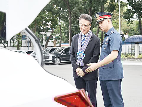 INSPECTION shows Hyundai Motor Philippines president Jiho Son (left) and PNP Director for Logistics PMGen Martin E. Defensor Jr. examining the Hyundai Elantra patrol vehicle during the turnover ceremony at Camp BGen Rafael T. Crame.