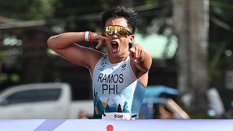 JOSHUA Ramos celebrates after crossing the finish line to rule the Filipino Elite Category at the 5150 Triathlon Guimaras on Sunday.