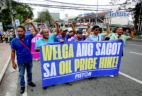 (March 09 2026) Transport group PISTON stage a protest in front of a gas station along East Avenue in Quezon City on Monday, March 9, 2026, to call on the government to remove the Value Added Tax (VAT) and excise tax on fuel products a day of impending big time oil price hike. Photo/Analy Labor