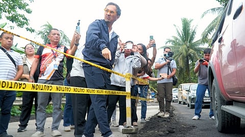 DEPARTMENT of Public Works and Highways Secretary Vince Dizon (center) is surrounded by reporters as he conduct an inspection on the repairs for the Maharlika Highway.