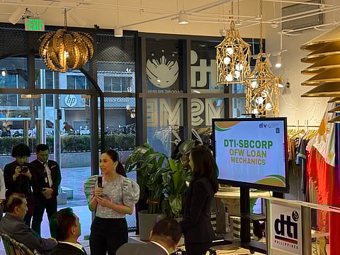 Trade Secretary Cristina A. Roque awards beneficiaries of the Women’s Enterprise Fund during the launch of the OFW Negosyo Fund and Export Business Expansion Financing at the DTI MSME Hub in Makati City on Wednesday, 11 March.