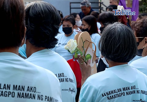 (March 11 2026) Families of EJK victims during the Duterte administration offer flowers and prayers for their departed loved ones along with photos, to mark the first anniversary of the arrest of former President Rodrigo Duterte by the International Criminal Court on Wednesday, March 11, 2026, at Sacred Heart Parish in Quezon City. Photo/Analy Labor
