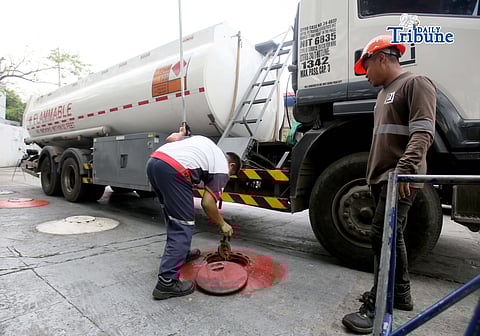(March 11 2026) Gas attendants measure the fuel  supply in their tanks at a gasoline station along East Avenue in Quezon City on Tuesday March 10 2026, following the hike in prices by oil companies due to the on-going conflict in the Middle East. Photo/Analy Labor