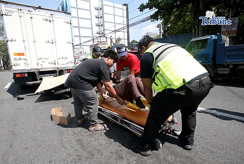 (March 11 2026) Quezon City Medics responded and rescued the accident involving a motorcycle and a closed van along Commonwealth Avenue in Quezon on Wednesday March 11 2026. Photo/Analy Labor
