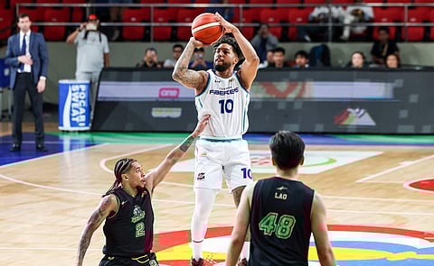 MIKEY Williams makes a brief appearance during Converge’s 102-94 win over the Macau Black Knights in the PBA Commissioner’s Cup on Wednesday.  