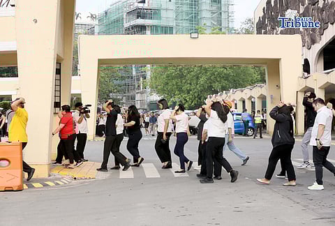 (March 12 2026) Quezon City Hall employees walk out the building as they participate in the First Quarter Nationwide Simultaneous Earthquake Drill, with the theme “Duck, Cover, and Hold: Gawin Dapat, Pero Hindi Sapat” on Thursday March 12 2026. Photo/Analy Labor
